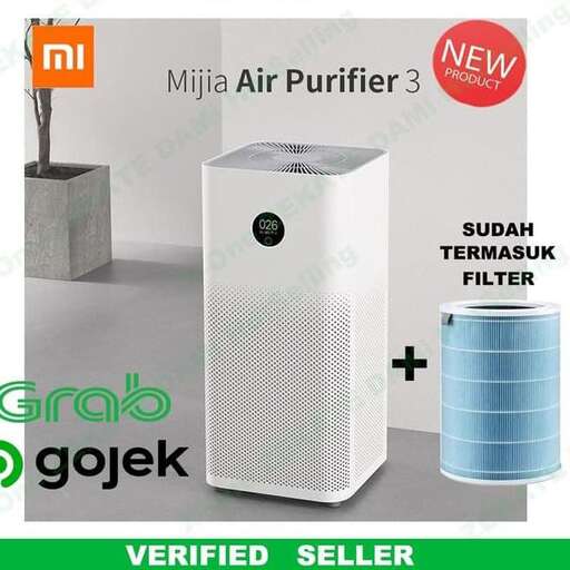 a white speaker with a black logo on it.