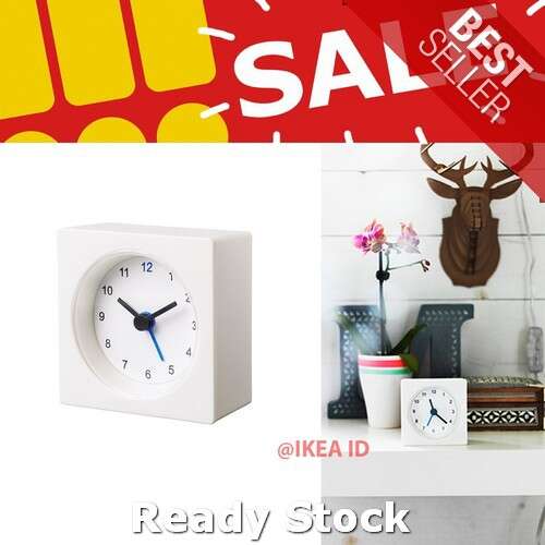 a clock with a white face and blue numbers on it.