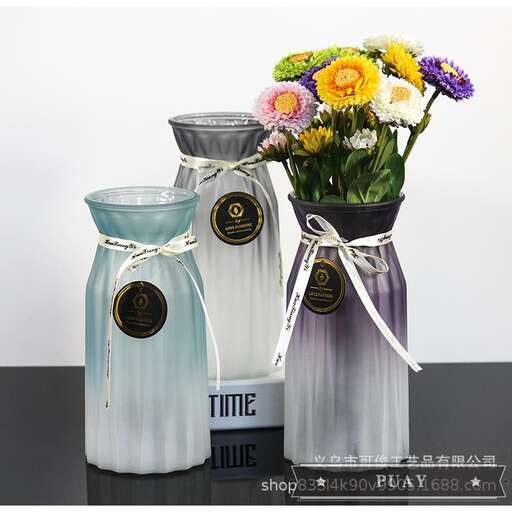 a couple of jars with flowers in them