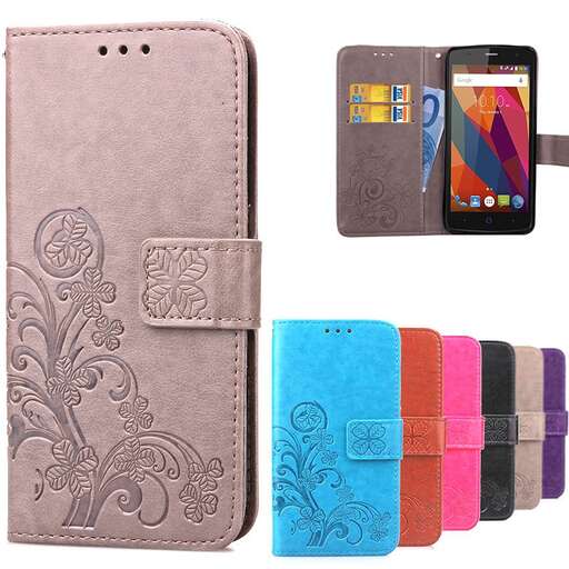 a case with a floral pattern and a leather strap.