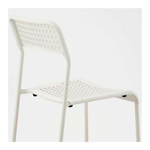 a white plastic chair with a black plastic seat.