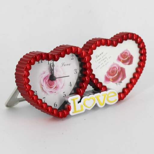a heart shaped brooch with a message