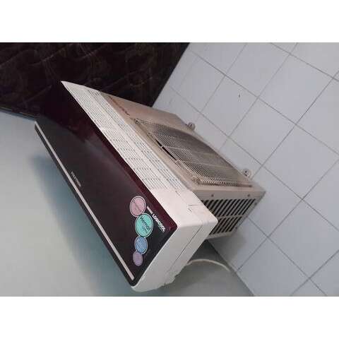 a small refrigerator with stickers on the door.