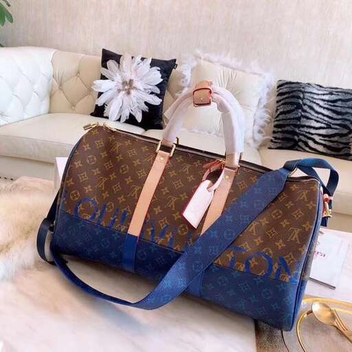 a bag with a blue strap on a couch.