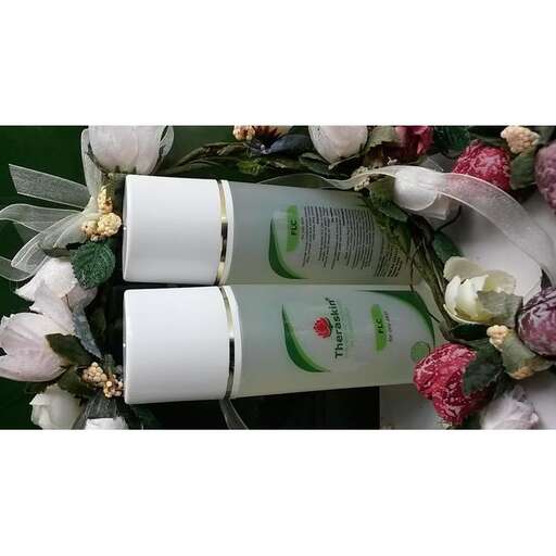 a flower crown with flowers and a bottle of shampoo.