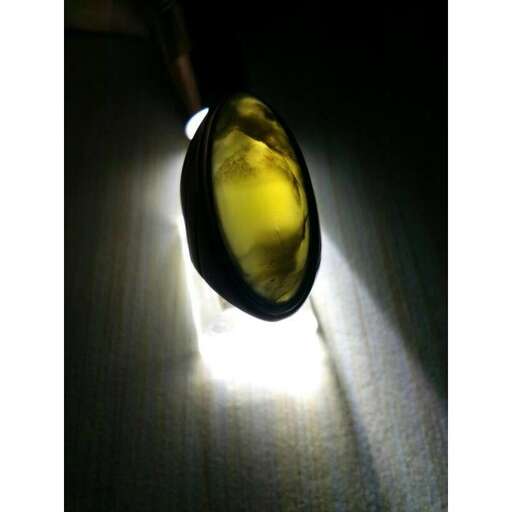 light in the dark, with a light shining through it.