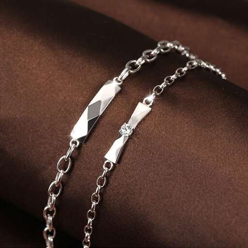 a sterling silver necklace with a diamond.