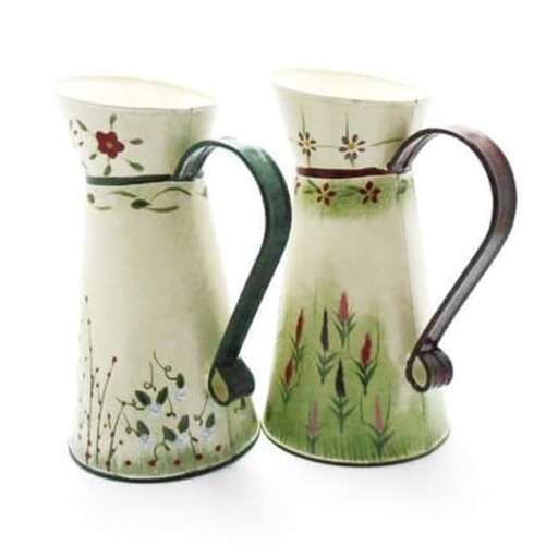 a pair of pitchers with flowers on them.