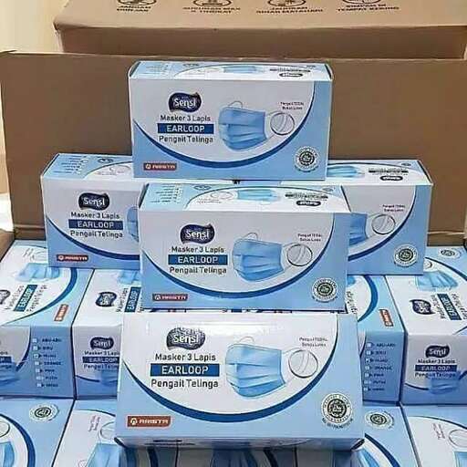 a stack of boxes with a lot of toothbrushes on top.