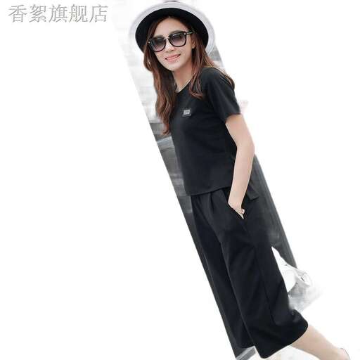 a girl in a black dress and hat