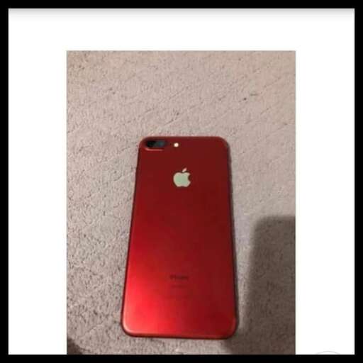 the back of a red phone with a red case.