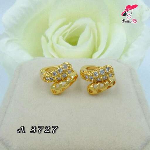 gold earrings with diamonds in the shape of a flower