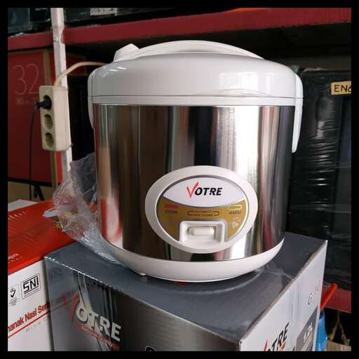 a white crock pot sitting on top of a box.