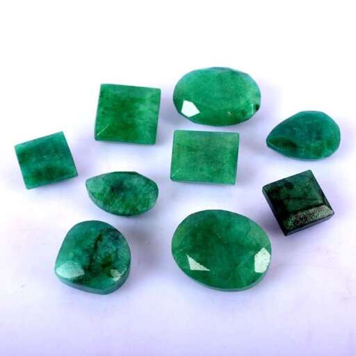 green glass gemstones in a white background