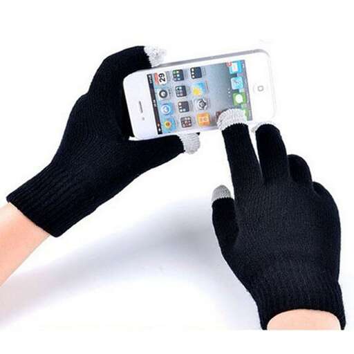 a person wearing gloves holding a cell phone.