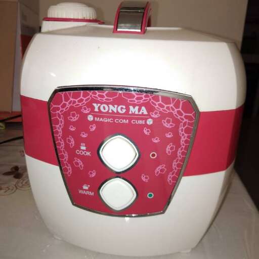 a toaster is shown on a table.