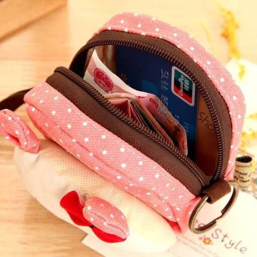 a backpack with a pink polka dot bag on top of it.