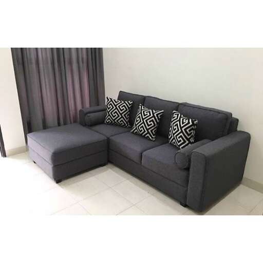a living room with a couch and a curtain