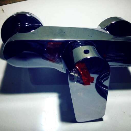 a skateboard with a red and blue body.