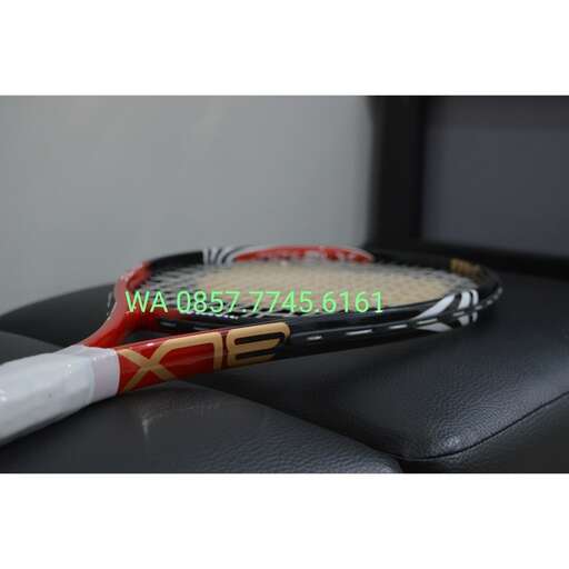 a tennis racket is sitting on a chair.