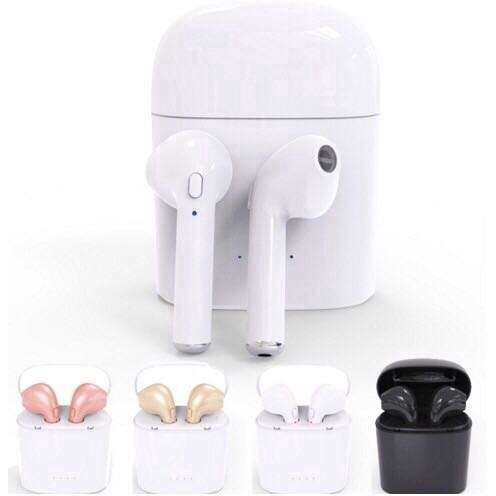 a white toilet with a black cup and a pink flower pot.