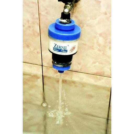 a water tap in a bathroom with a blue top.