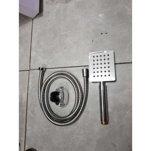 a hose and a hose on a tile floor.
