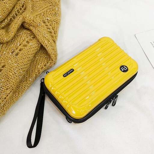 a yellow case with a black strap on it.