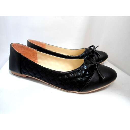 a pair of black leather shoes with gold trim.