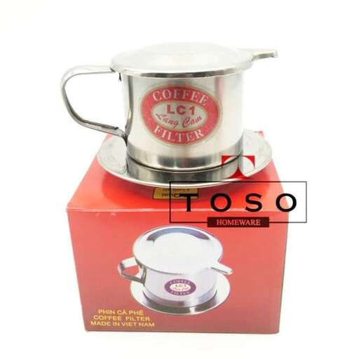 a silver tea pot on a red box