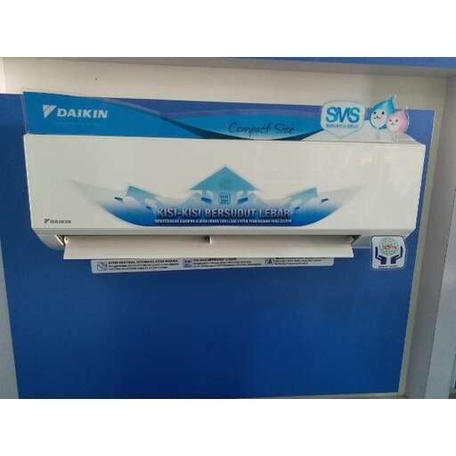 a blue machine with a white logo on it.