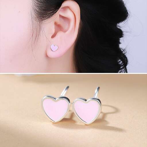 heart shaped earrings in sterling silver with a pink heart shaped hole.