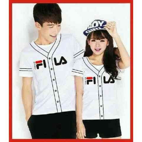 a boy and a girl in a white and red baseball jersey.