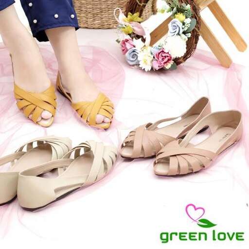 a pair of tan shoes with a pink heart on the bottom.