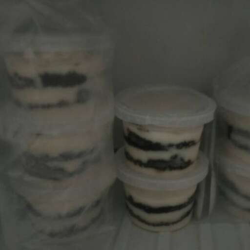 a refrigerator filled with containers of food in a refrigerator.