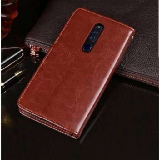 a brown leather cell phone with a black case on it.