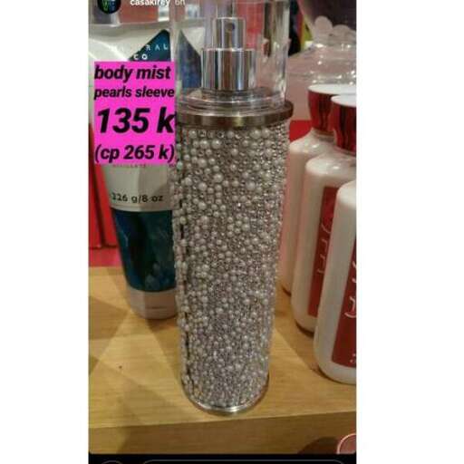 a glass pepper shaker with beads in it.