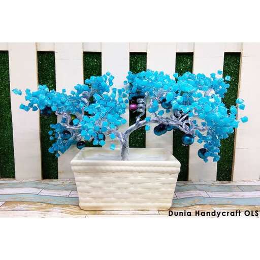 blue tree in a white pot