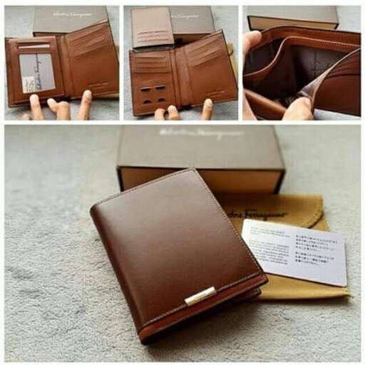 a brown leather wallet with a note and a notepad on it.