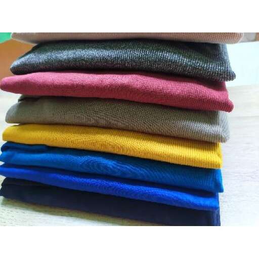 a stack of colorful clothes.