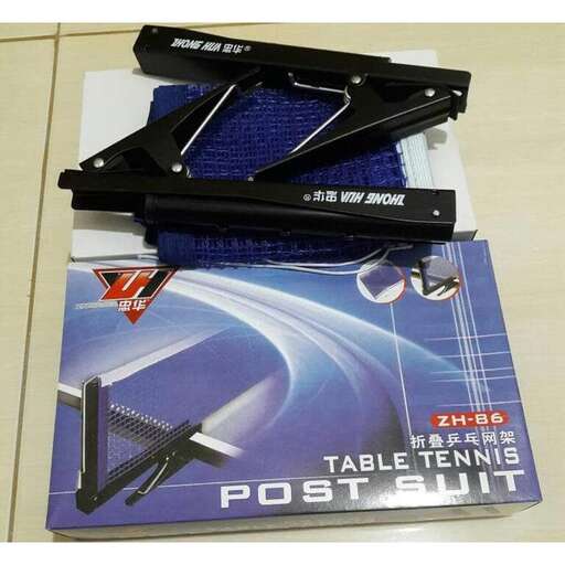 a table with a pair of scissors and a game controller on it.