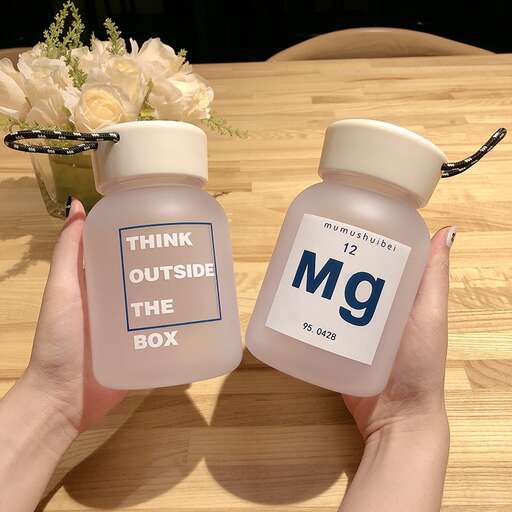 a bottle of chemical compound and a bottle of vitamin water.