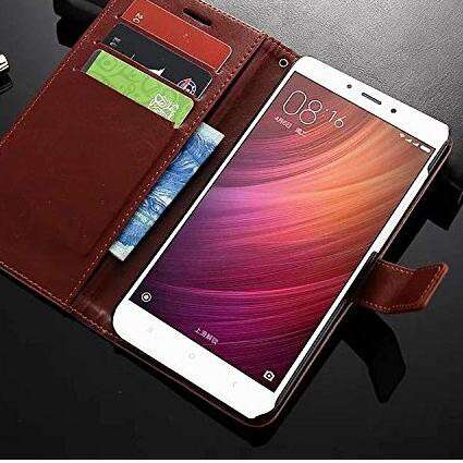 a smartphone with a leather strap and a leather strap.