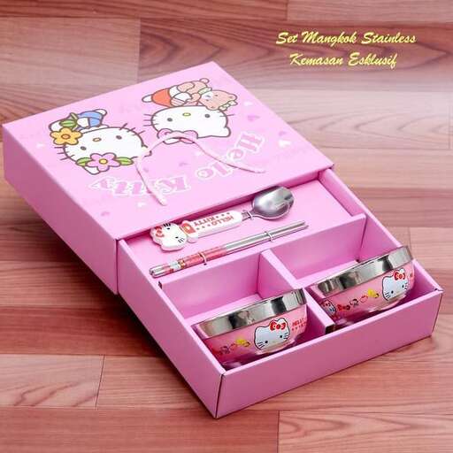 a pink box with hello kitty items inside.