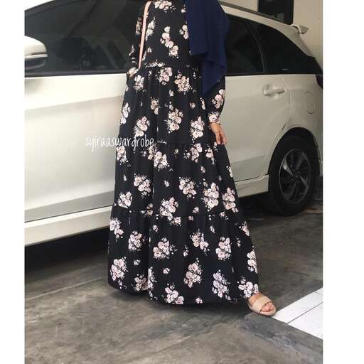 actor in a floral maxi dress