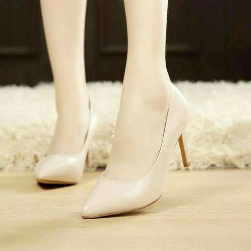 a pair of shoes with heels on the floor.