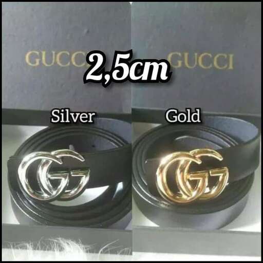 a pair of silver bracelets with a gold design