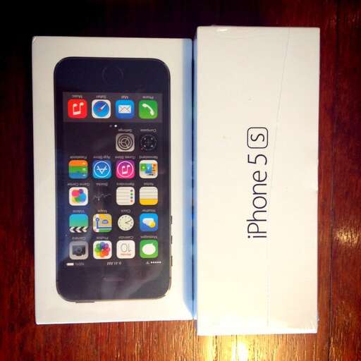 a black and white iphone box with a white box on top.