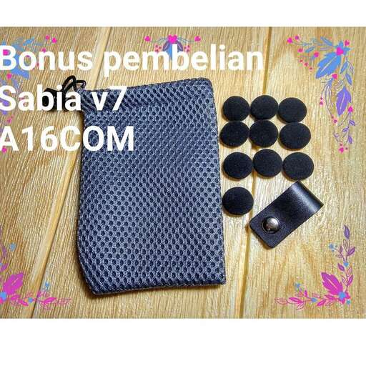 a blue tie and some black accessories on a table.