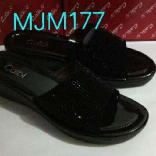 a pair of black flip flops with a black sole.